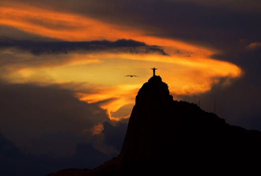 A captivating sunset silhouette of Christ the Redeemer in Rio de Janeiro, Brazil, exuding tranquility and beauty.