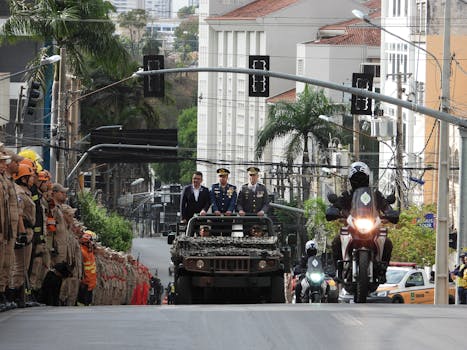 A military and firefighter parade in a city street, showcasing emergency response coordination in Brasil.