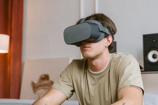 Young man using VR headset indoors, exploring virtual reality with focus and engagement.
